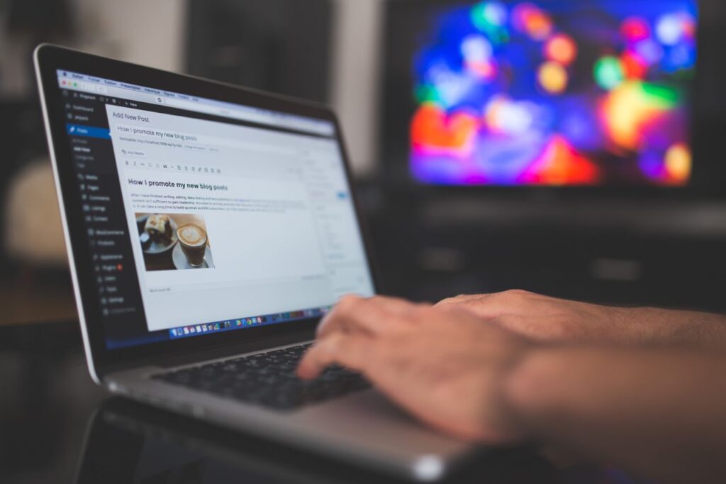 Someone at a laptop about to edit a website using WordPress.
